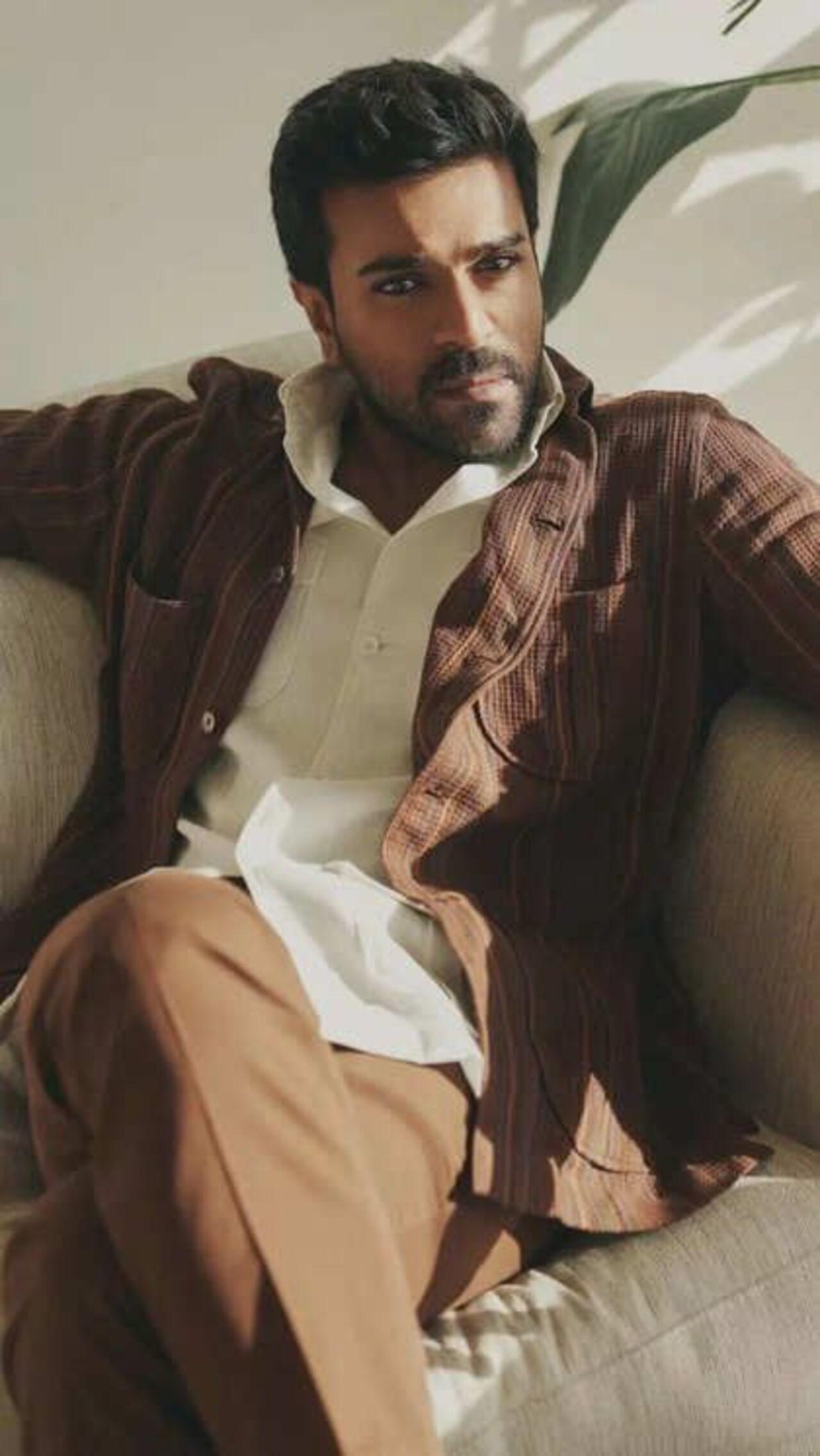 Creating the perfect harmony of colours, Ram looks dashing in this brown vertical pinstripe blazer, with a white collared shirt and brown pants.